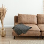 Brown couch on hardwood floor